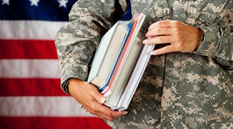 military service member holding books
