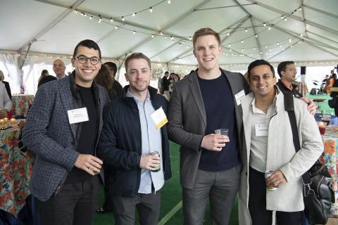 four JHU alumni buddies reconnecting at the networking session