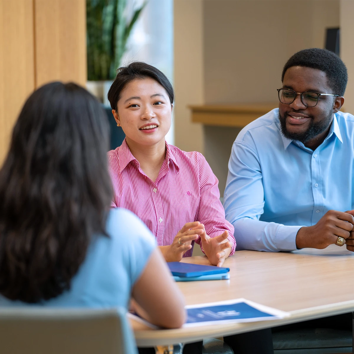 Students sitting at a table in discussion