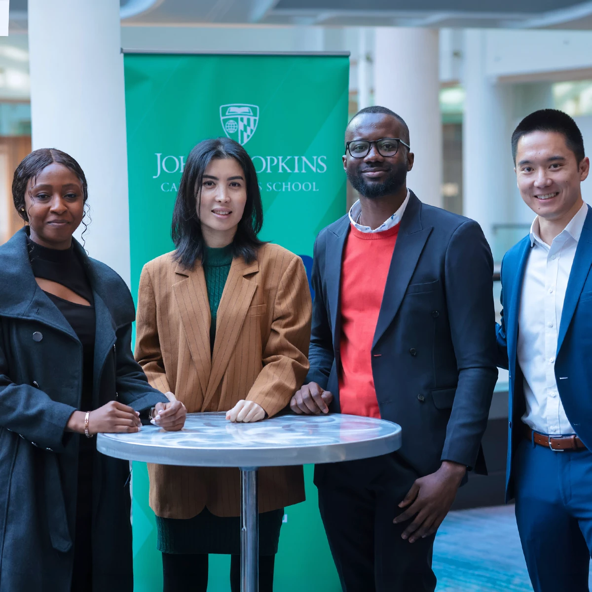 Students at event smiling at the camera