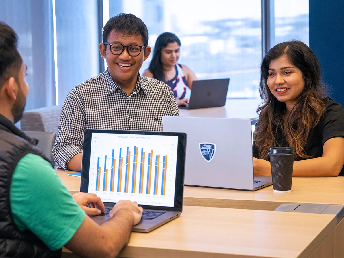 Students working together at a table.