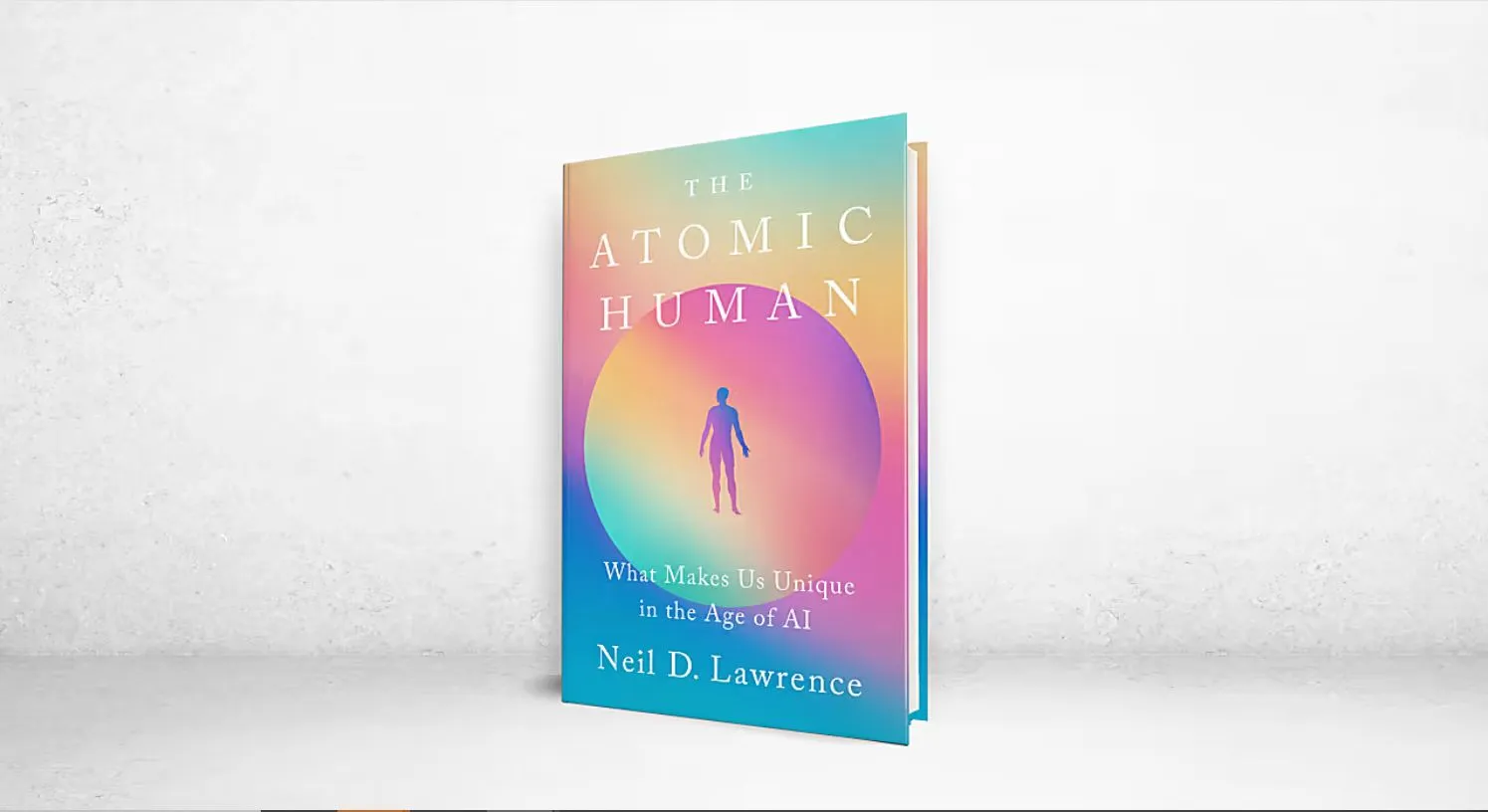 A multicolored cover of a book called Atomic Human