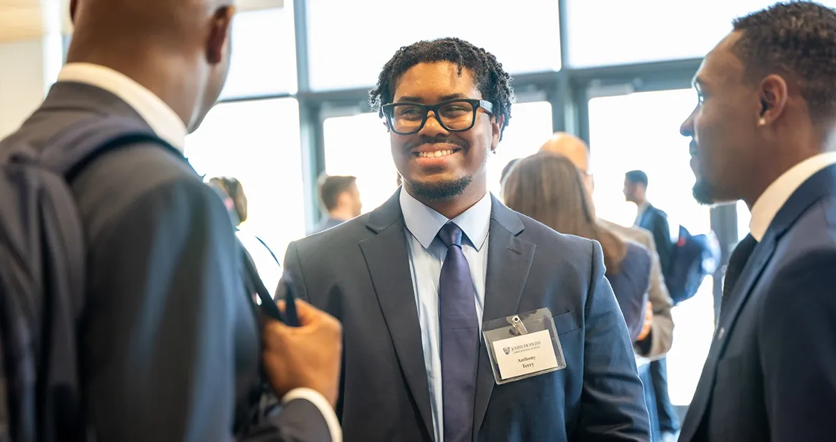 Students in discussion at networking event