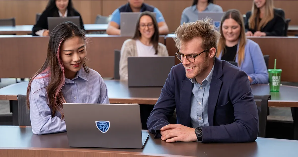 Students working together on computer