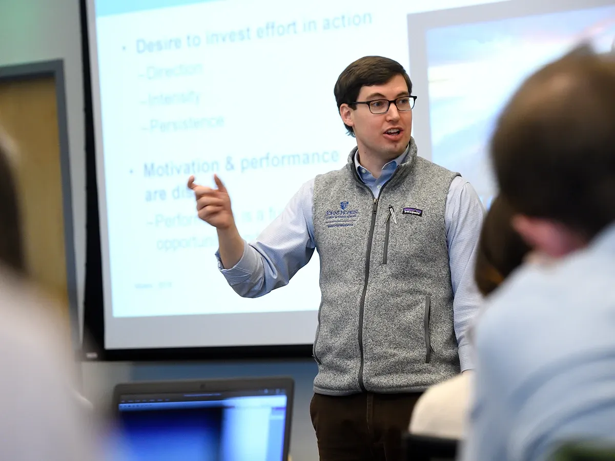 Christopher Myers teaching a class of students