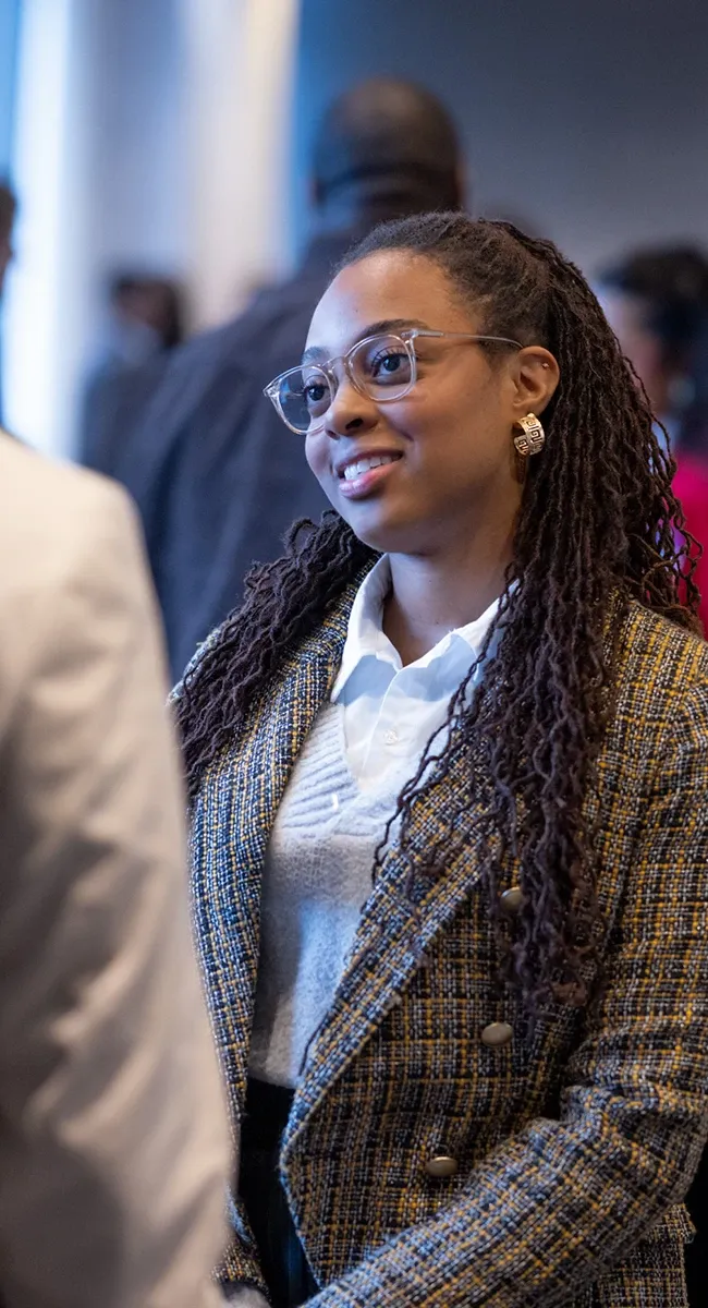 Student in discussion at networking event