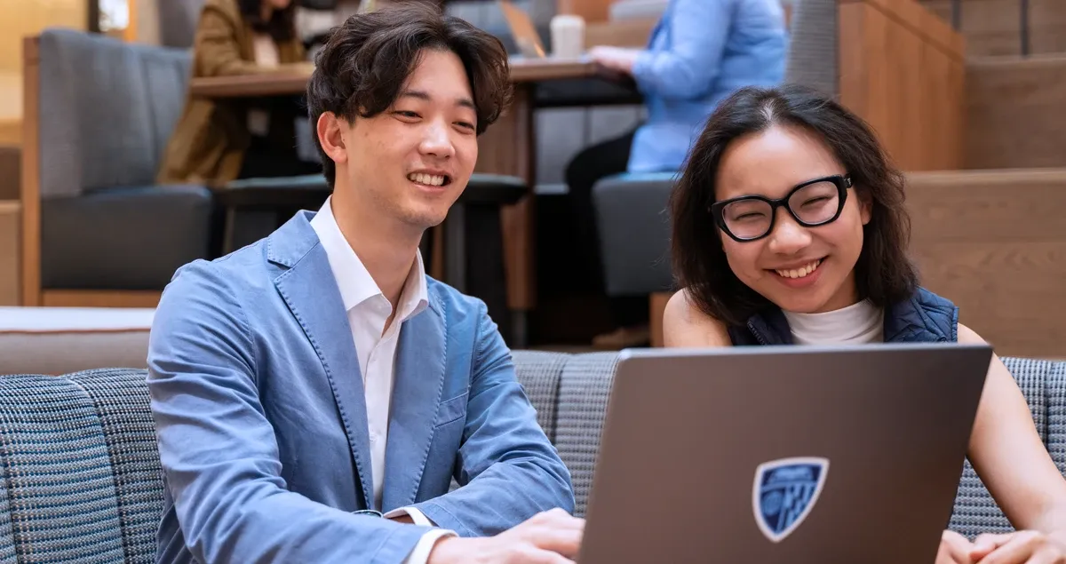 Students working together on computer