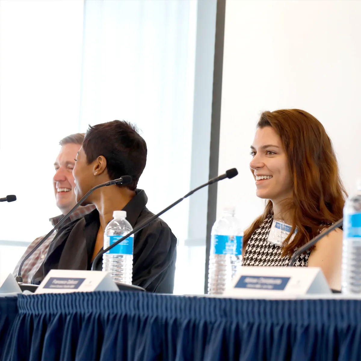 Student panelists speaking into microphones
