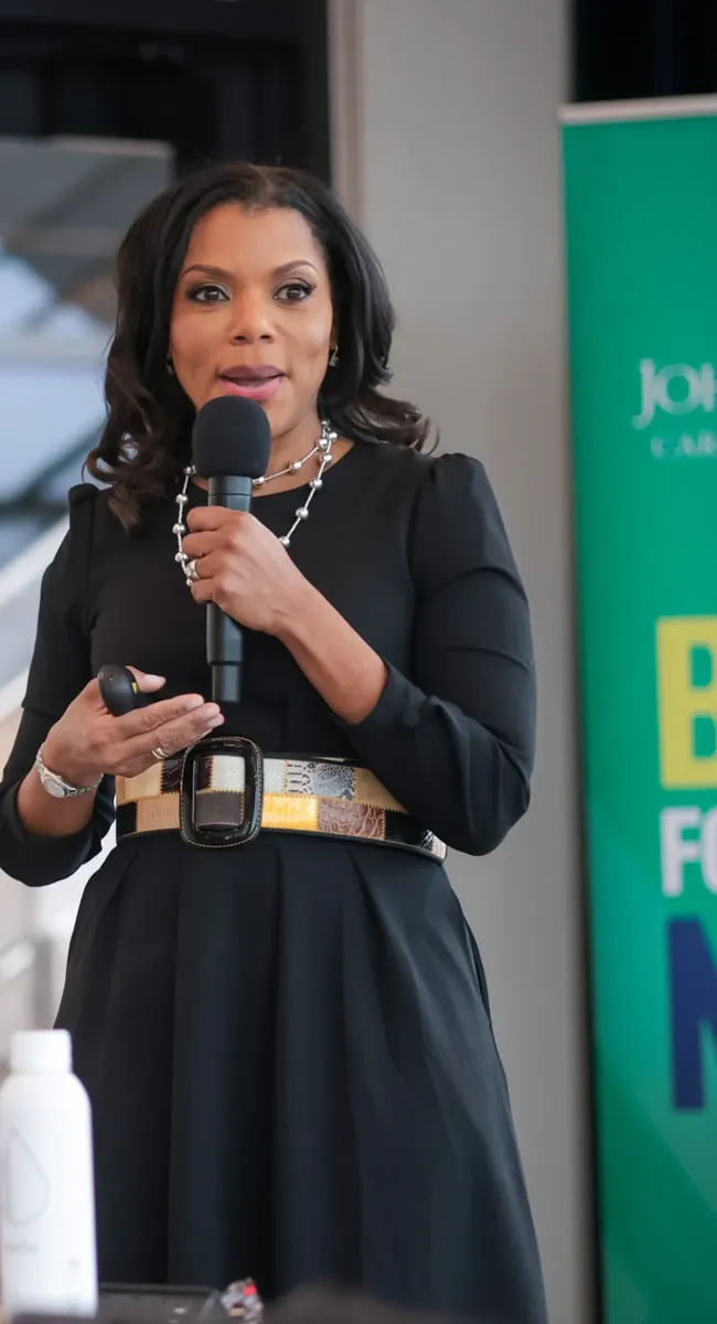 Woman speaking into a microphone