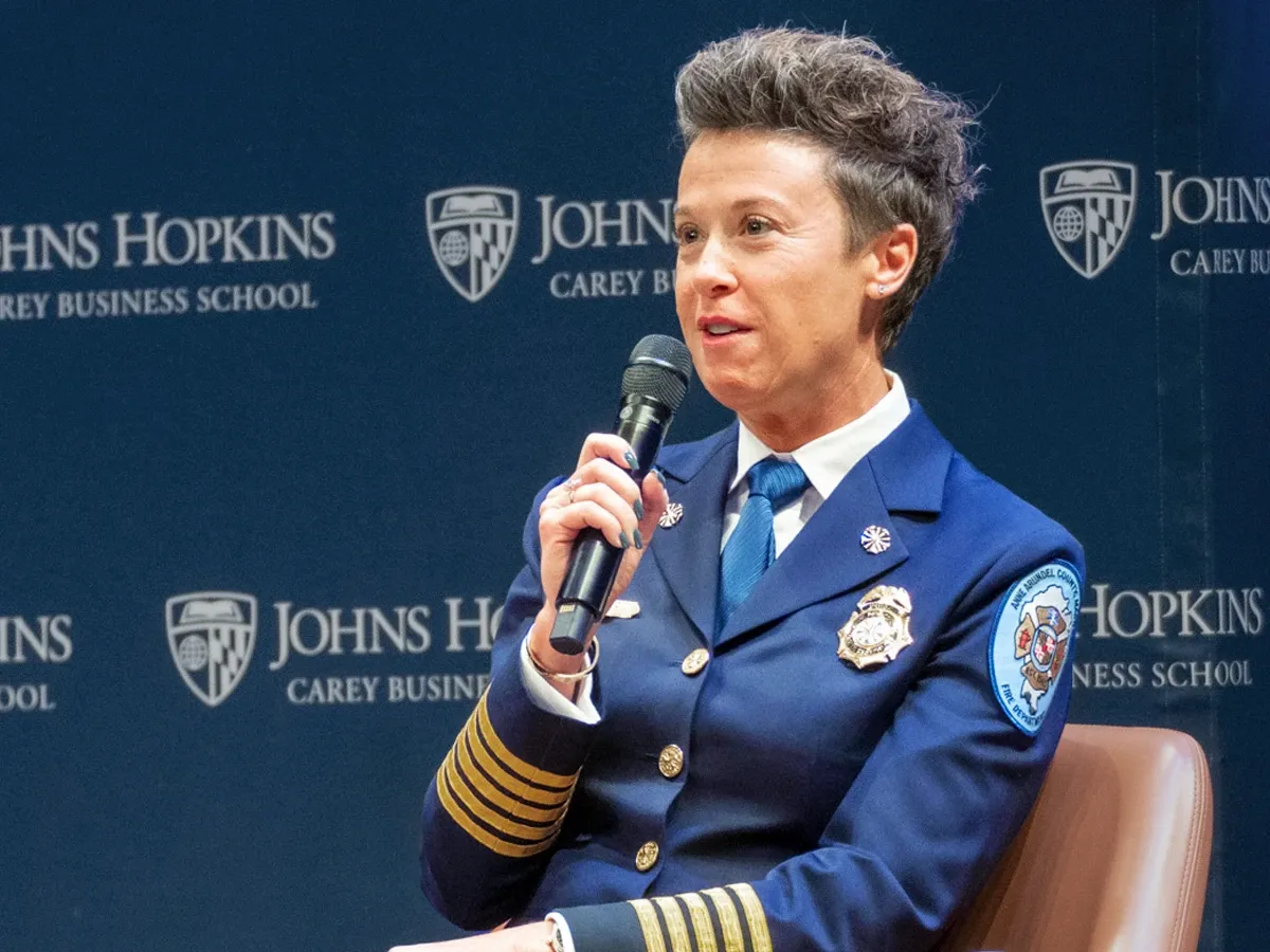 First responder speaks on stage at HCLF event