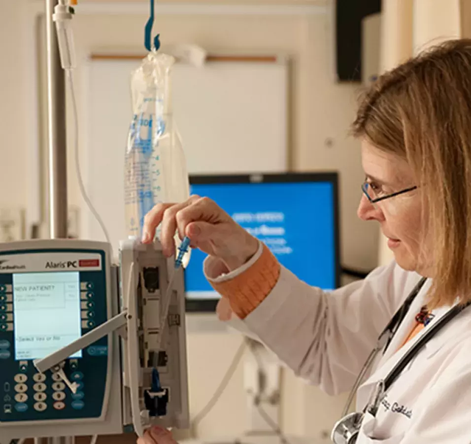 Elizabeth Cherot operating an Alaris PC medical intravenous device