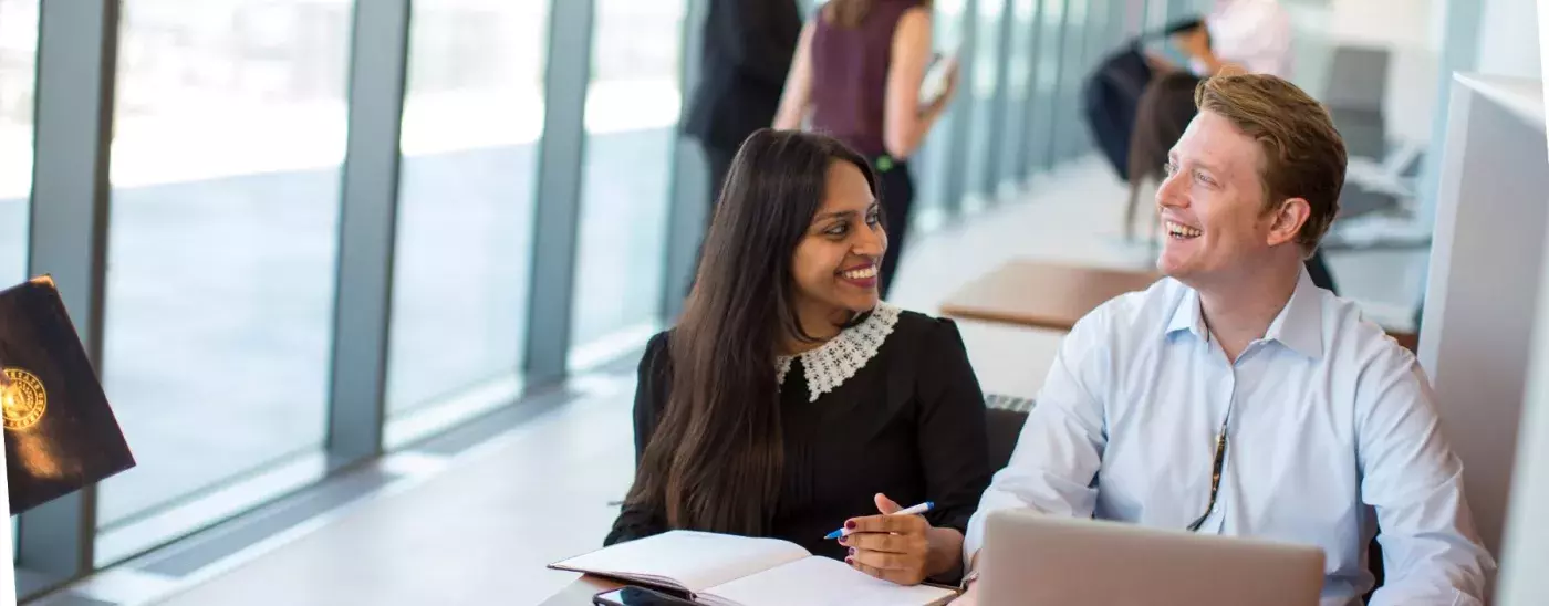 students at a table talking