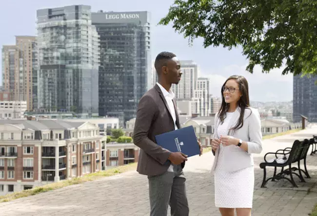 carey students talking on federal hill near the baltimore campus of the johns hopkins carey business school