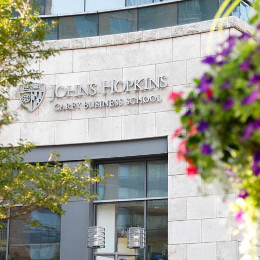 The Johns Hopkins Carey Business School logo