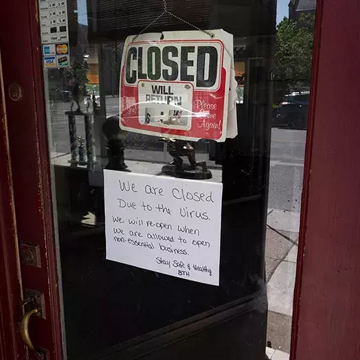 closed sign in story window