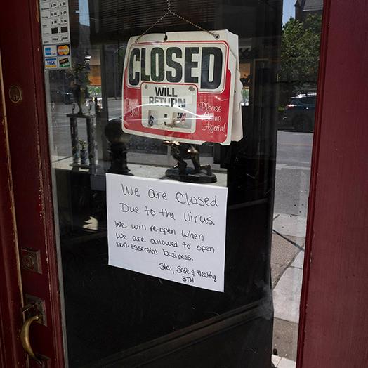closed sign in story window