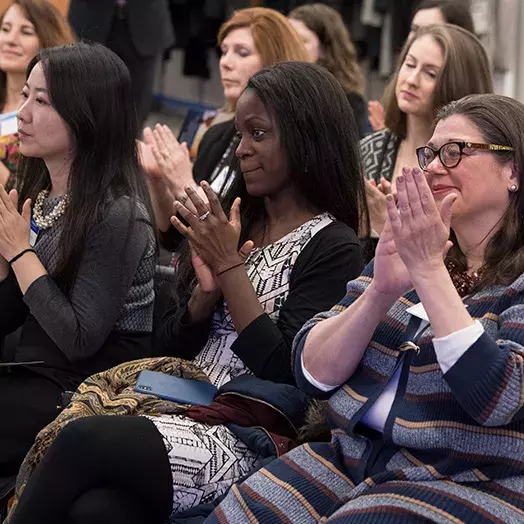 women clapping