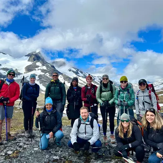 students in front of mountains