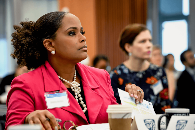 AWL banner image group of women listening in a conference