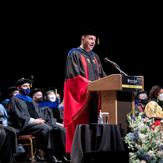 graduation speaker at podium