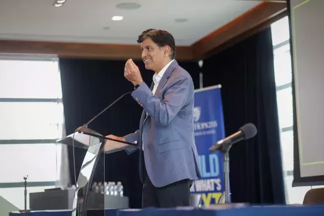 speaker at conference lectern