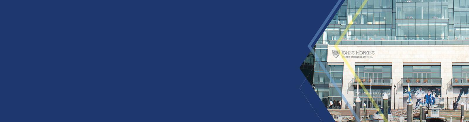 blue hero banner with Baltimore campus exterior and boats anchored at docks