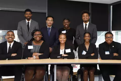 a group of young adults pose for a shot after the Summer Business Academy program