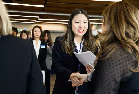 students shaking hands