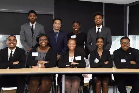 students sitting across the table 