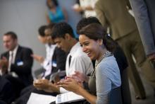 Full-time MS programs student clapping at the new student orientation at the johns hopkins carey business school