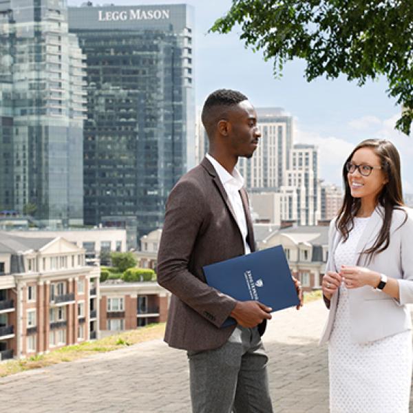 Two students talking outside the Baltimore campus