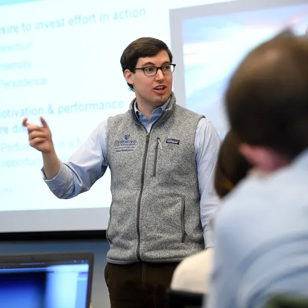 Christopher Myers teaching a class of students